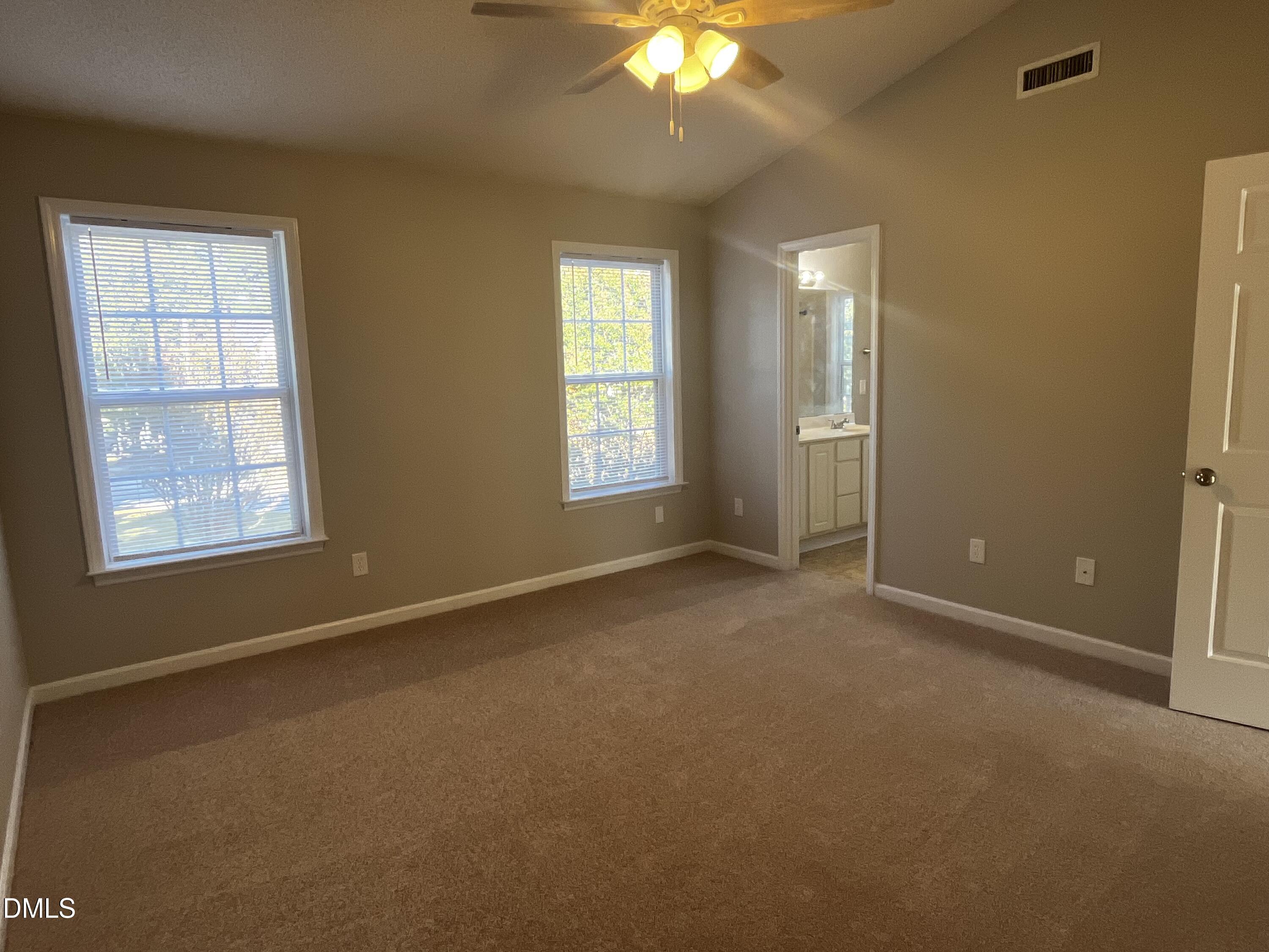 5500 Marthonna Way Raleigh, NC 27616 - Photo 10 of 19 an empty room with windows and fan