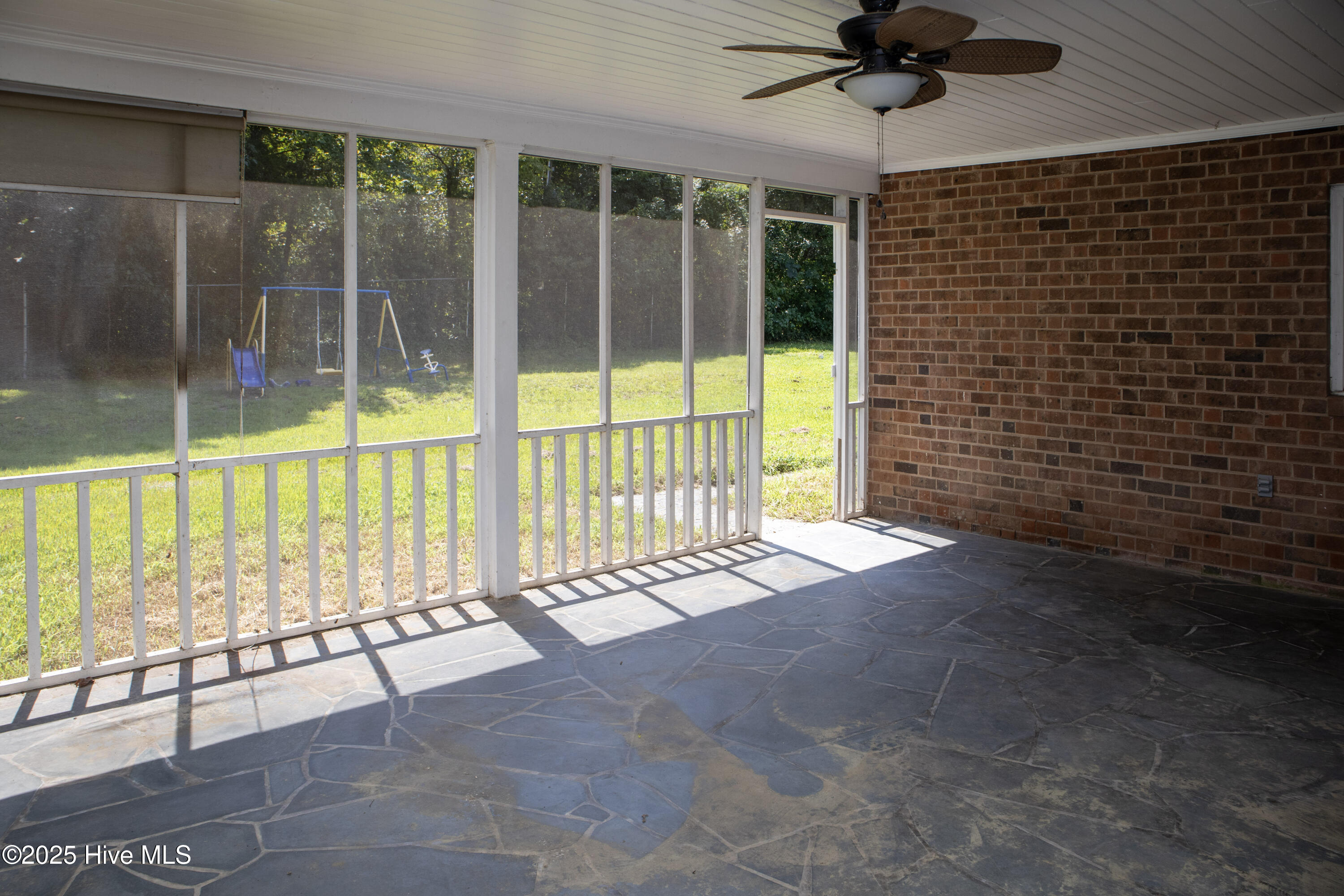 119 Watson Street Enfield, NC 27823 - Photo 32 of 38 Screened porch