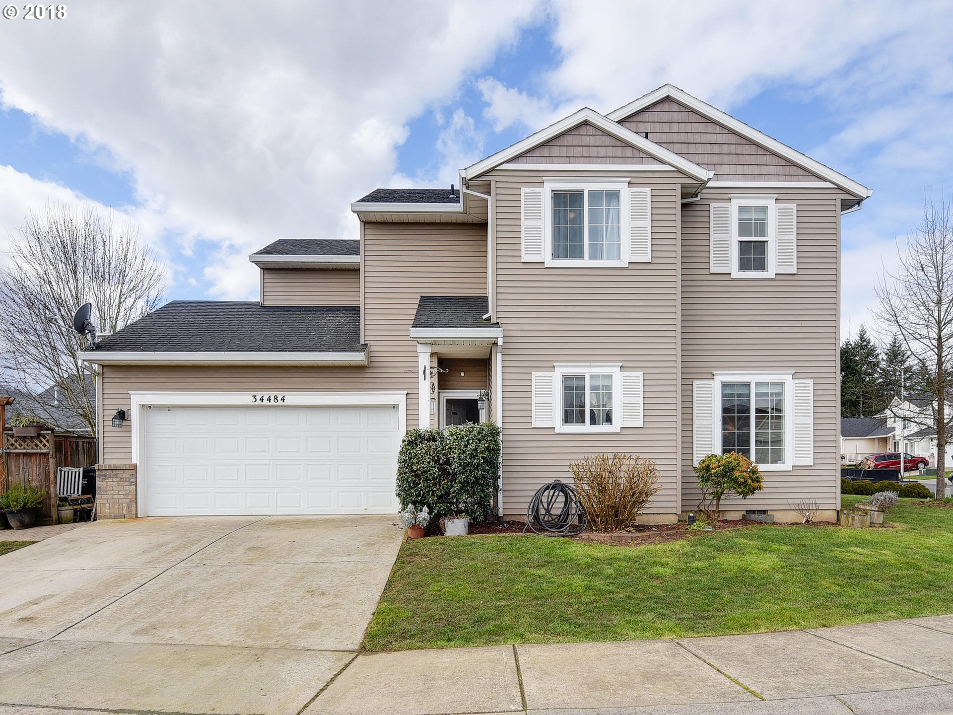 34484 Vail Court St. Helens, OR 97051 - Photo 1 of 16 a front view of a house with a garden