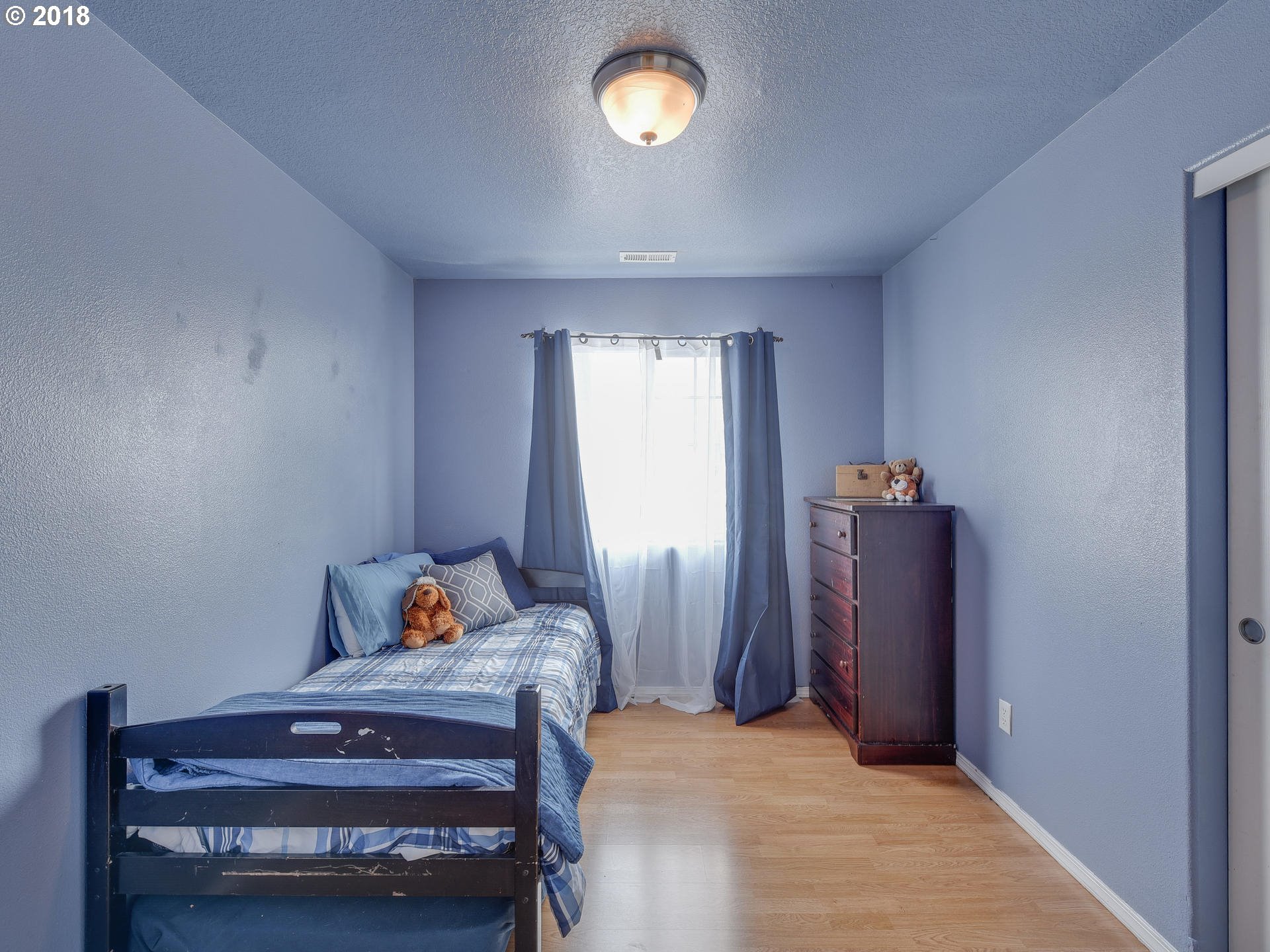34484 Vail Court St. Helens, OR 97051 - Photo 14 of 16 a bedroom with a bed and a window