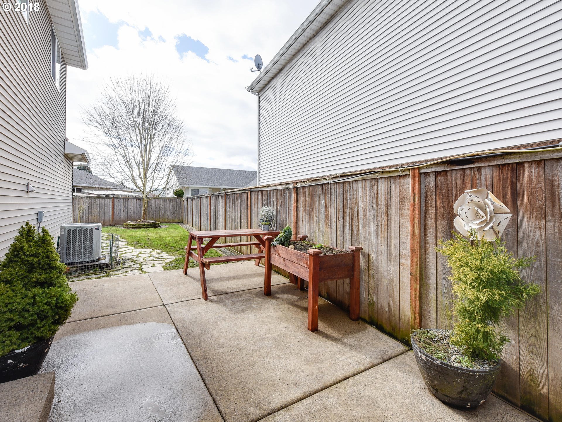 34484 Vail Court St. Helens, OR 97051 - Photo 15 of 16 a view of a patio with a table and chairs and plants
