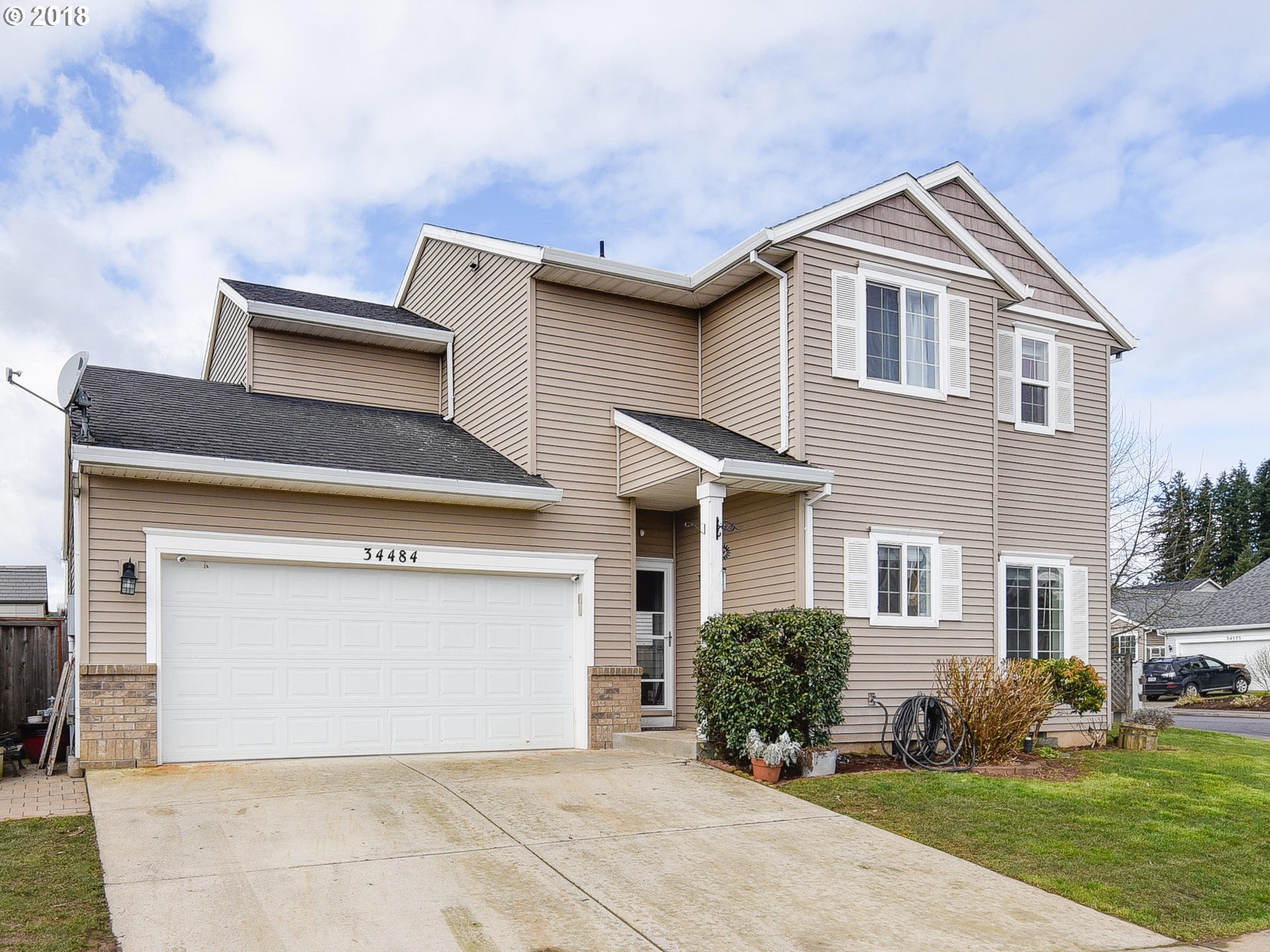34484 Vail Court St. Helens, OR 97051 - Photo 2 of 16 a front view of a house with a yard and garage