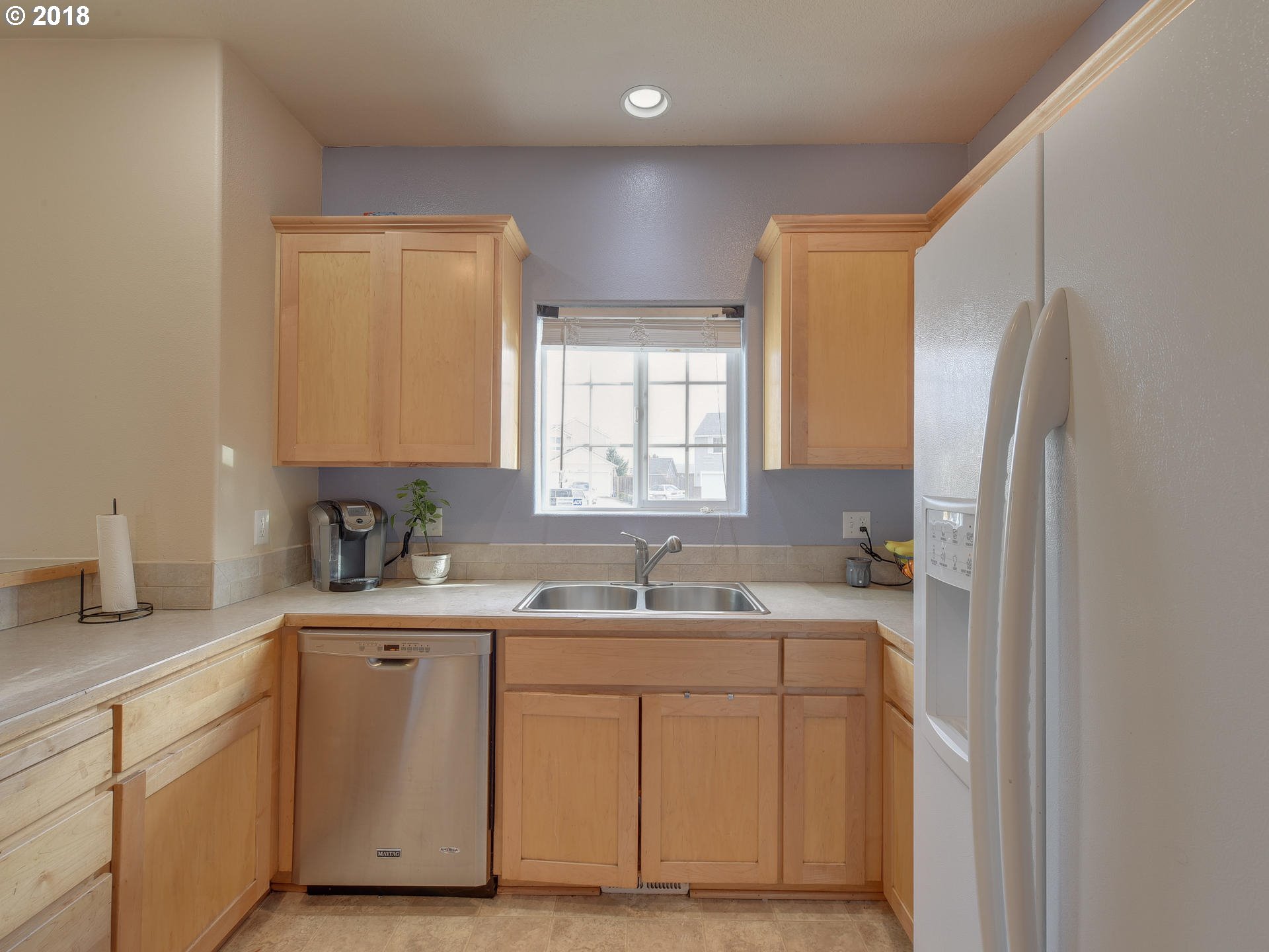34484 Vail Court St. Helens, OR 97051 - Photo 6 of 16 a kitchen with a sink cabinets and window