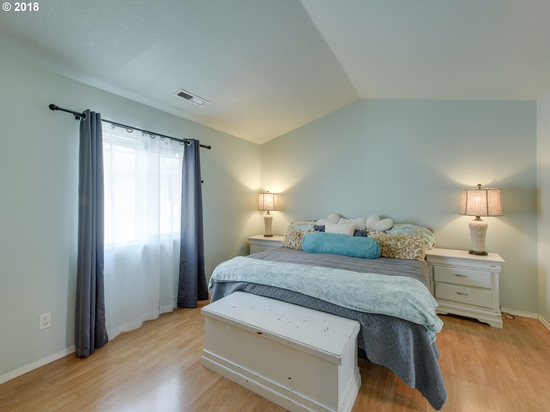 34484 Vail Court St. Helens, OR 97051 - Photo 10 of 16 a bedroom with a bed and a lamp