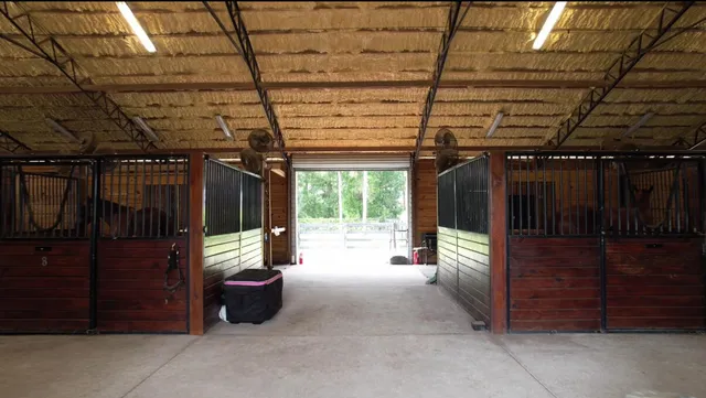 a view of a porch with furniture and a garage