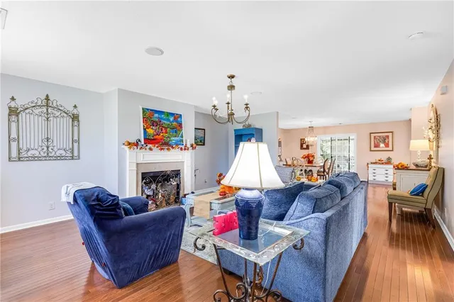 a bathroom with a granite countertop toilet a sink and a mirror
