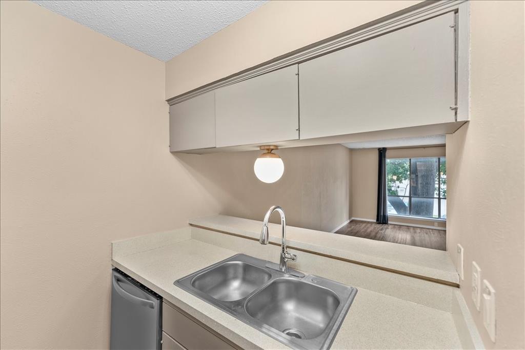 4859 Cedar Springs Road, Unit 241 Dallas, TX 75219 - Photo 11 of 38 a close view of sink and tap