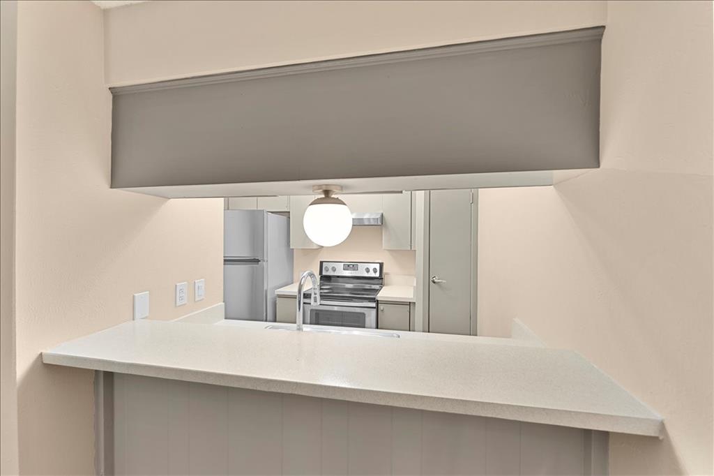 4859 Cedar Springs Road, Unit 241 Dallas, TX 75219 - Photo 14 of 38 a bathroom with a sink and a mirror