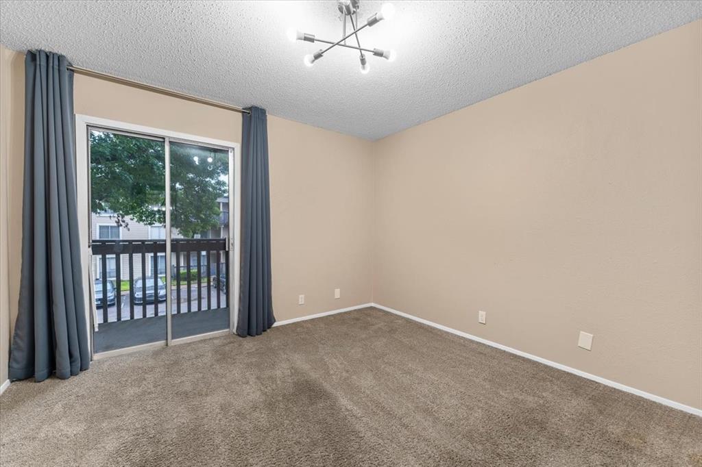 4859 Cedar Springs Road, Unit 241 Dallas, TX 75219 - Photo 15 of 38 a view of a livingroom with a ceiling fan and window