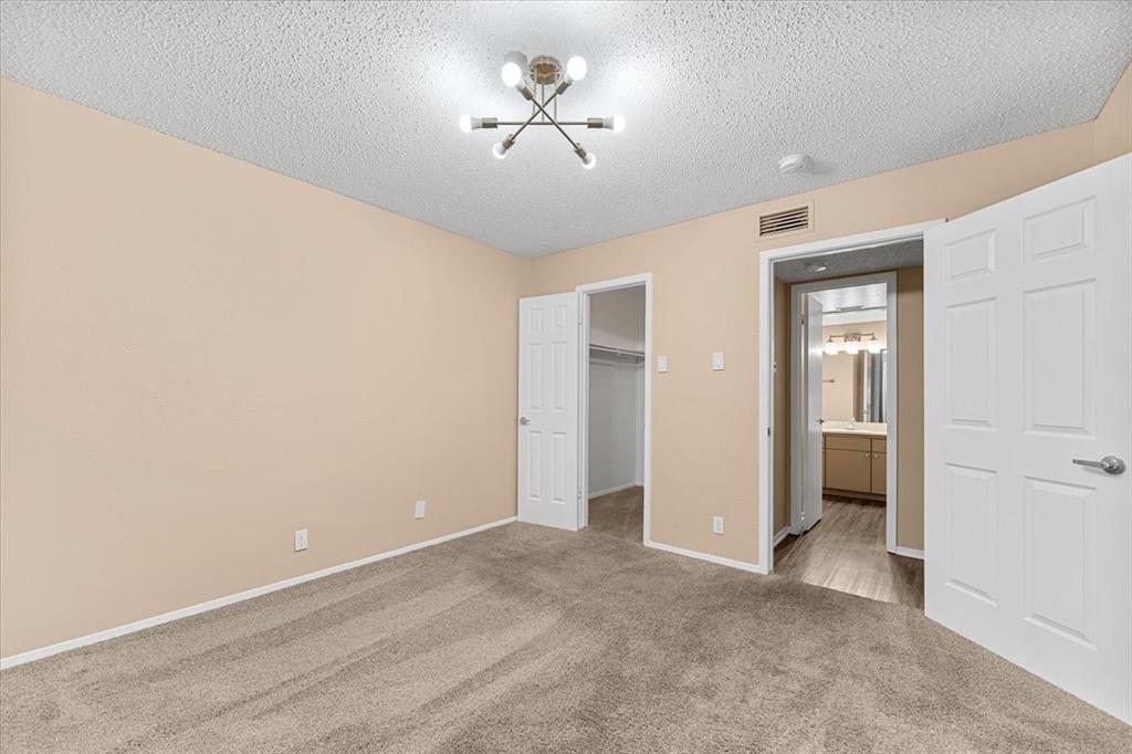 4859 Cedar Springs Road, Unit 241 Dallas, TX 75219 - Photo 16 of 38 a view of an empty room with a window