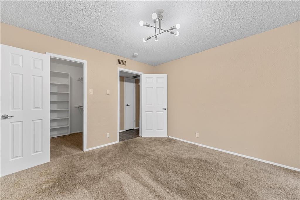 4859 Cedar Springs Road, Unit 241 Dallas, TX 75219 - Photo 17 of 38 a view of a big room with chandelier fan