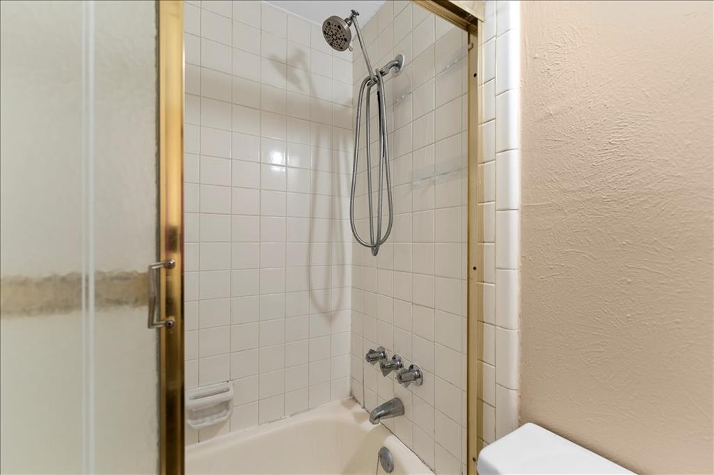 4859 Cedar Springs Road, Unit 241 Dallas, TX 75219 - Photo 25 of 38 a bathroom with a shower