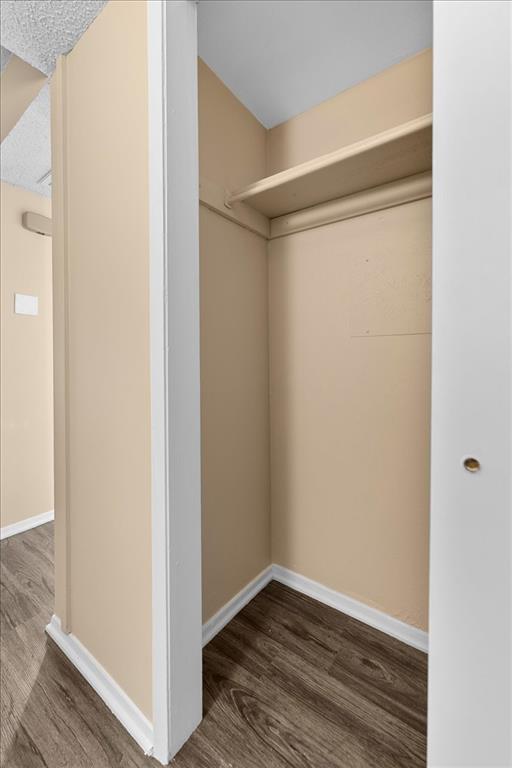 4859 Cedar Springs Road, Unit 241 Dallas, TX 75219 - Photo 26 of 38 a view of an empty room with wooden floor