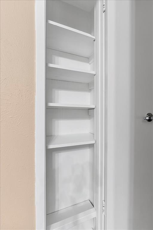 4859 Cedar Springs Road, Unit 241 Dallas, TX 75219 - Photo 27 of 38 a view of walk in closet with empty racks