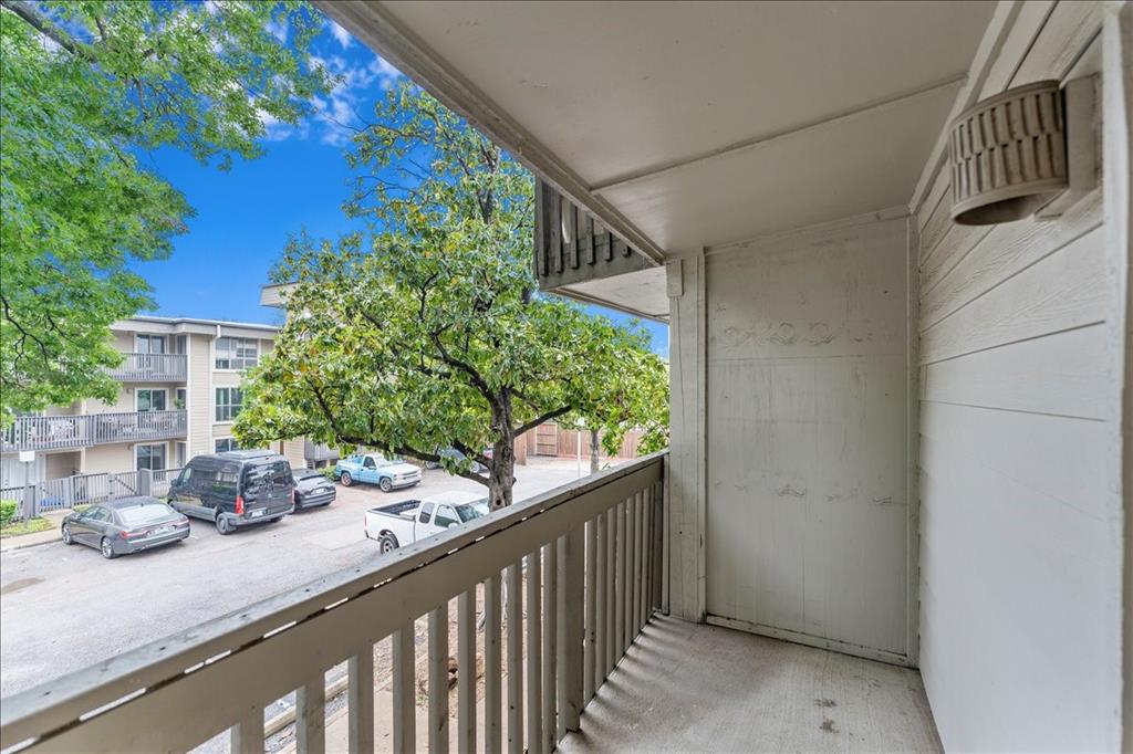 4859 Cedar Springs Road, Unit 241 Dallas, TX 75219 - Photo 31 of 38 a view of a balcony and trees