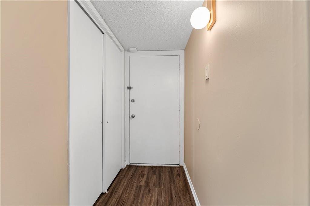4859 Cedar Springs Road, Unit 241 Dallas, TX 75219 - Photo 36 of 38 a view of a hallway with wooden floor