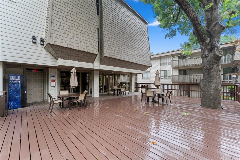4859 Cedar Springs Road, Unit 241 Dallas, TX 75219 - Photo 38 of 38 a view of a patio with table and chairs and wooden floor