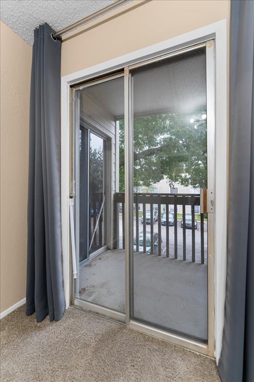 4859 Cedar Springs Road, Unit 241 Dallas, TX 75219 - Photo 6 of 38 a view of a glass door and the porch