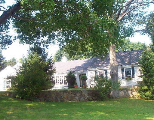 30 Tanglewood Court Ridgefield, CT 06877 - Photo 1 of 1 a front view of house with yard and green space