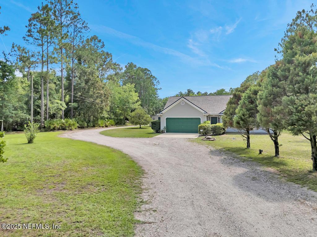 7041 Catlett Road St. Augustine, FL 32095 - Photo 8 of 59 a front view of a house with a yard