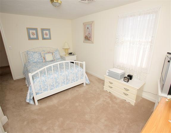 985 Trapelo Road, Unit 5 Waltham, MA 02452 - Photo 12 of 15 a bathroom with a white bed and a window