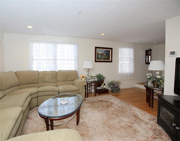 985 Trapelo Road, Unit 5 Waltham, MA 02452 - Photo 5 of 15 a living room with furniture and a window