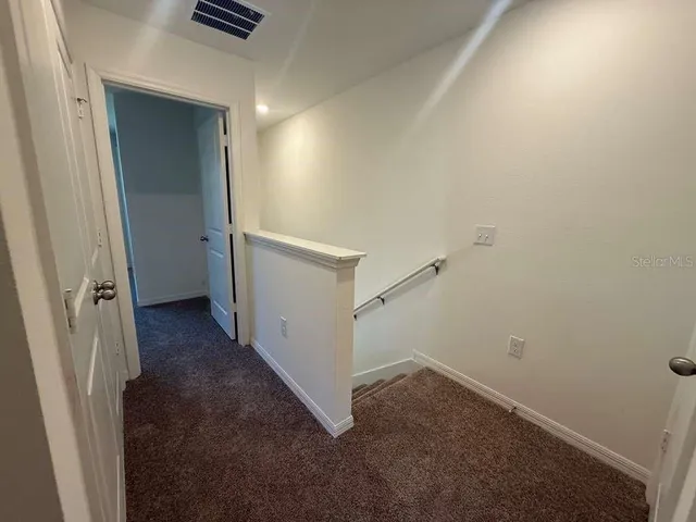 a view of a hallway with storage