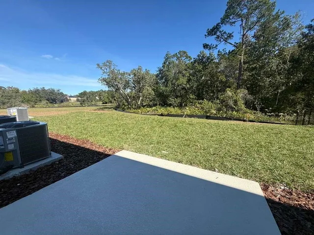 a view of a lake with a big yard