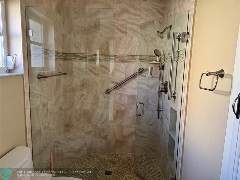 3727 Southwest Whispering Sound Drive Palm City, FL 34990 - Photo 18 of 29 a bathroom with a shower