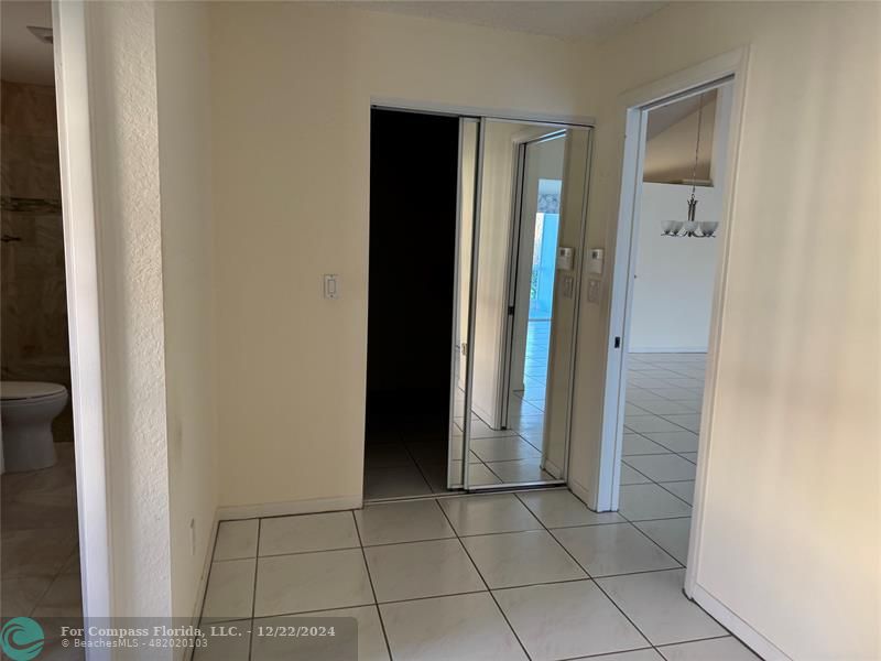 3727 Southwest Whispering Sound Drive Palm City, FL 34990 - Photo 21 of 29 an empty room that has a bathroom in it