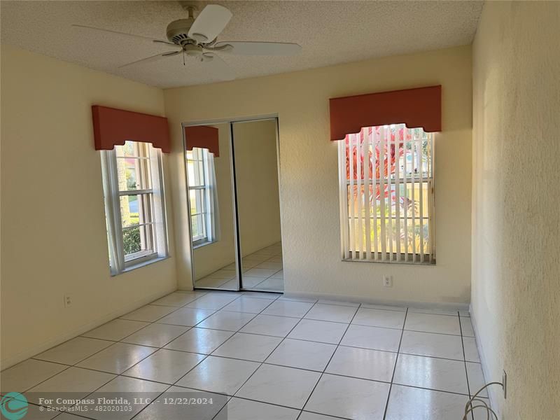 3727 Southwest Whispering Sound Drive Palm City, FL 34990 - Photo 5 of 29 a view of an empty room with a window