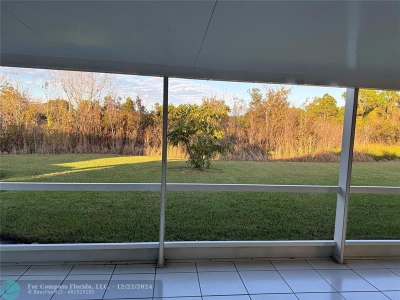 3727 Southwest Whispering Sound Drive Palm City, FL 34990 - Photo 9 of 29 a view of a back yard