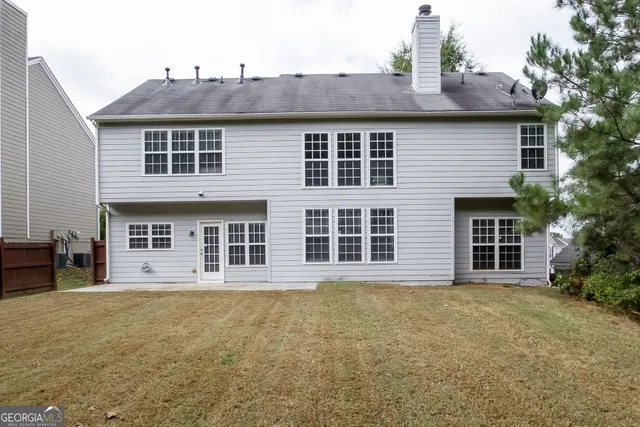 a front view of a house with large windows