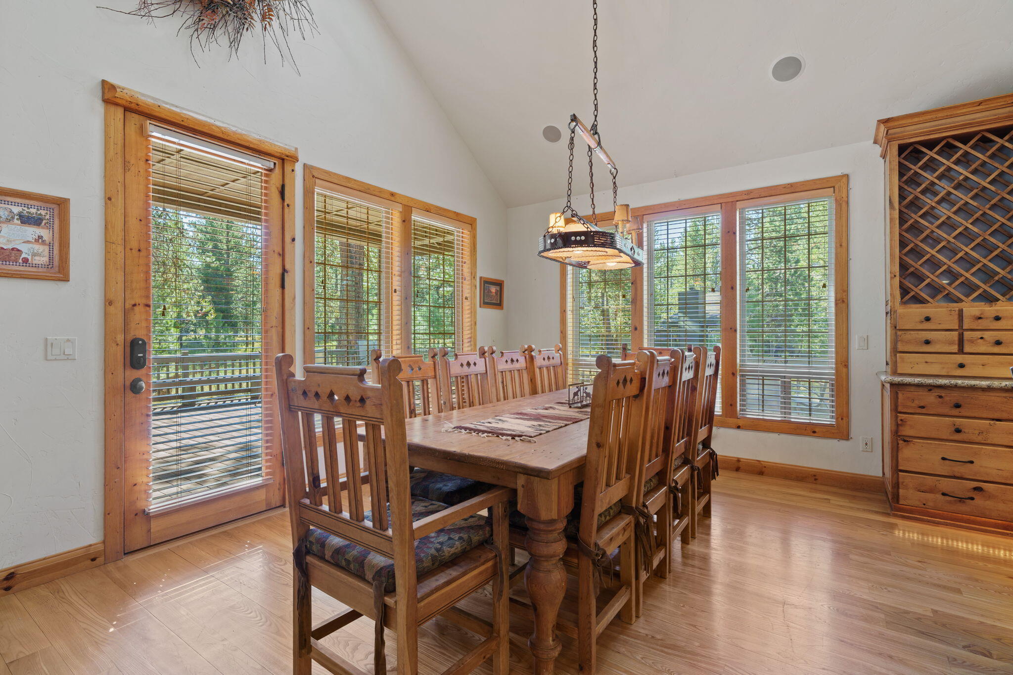 58026 Kinglet Road Sunriver, OR 97707 - Photo 10 of 39 a view of a dining room with furniture window and wooden floor