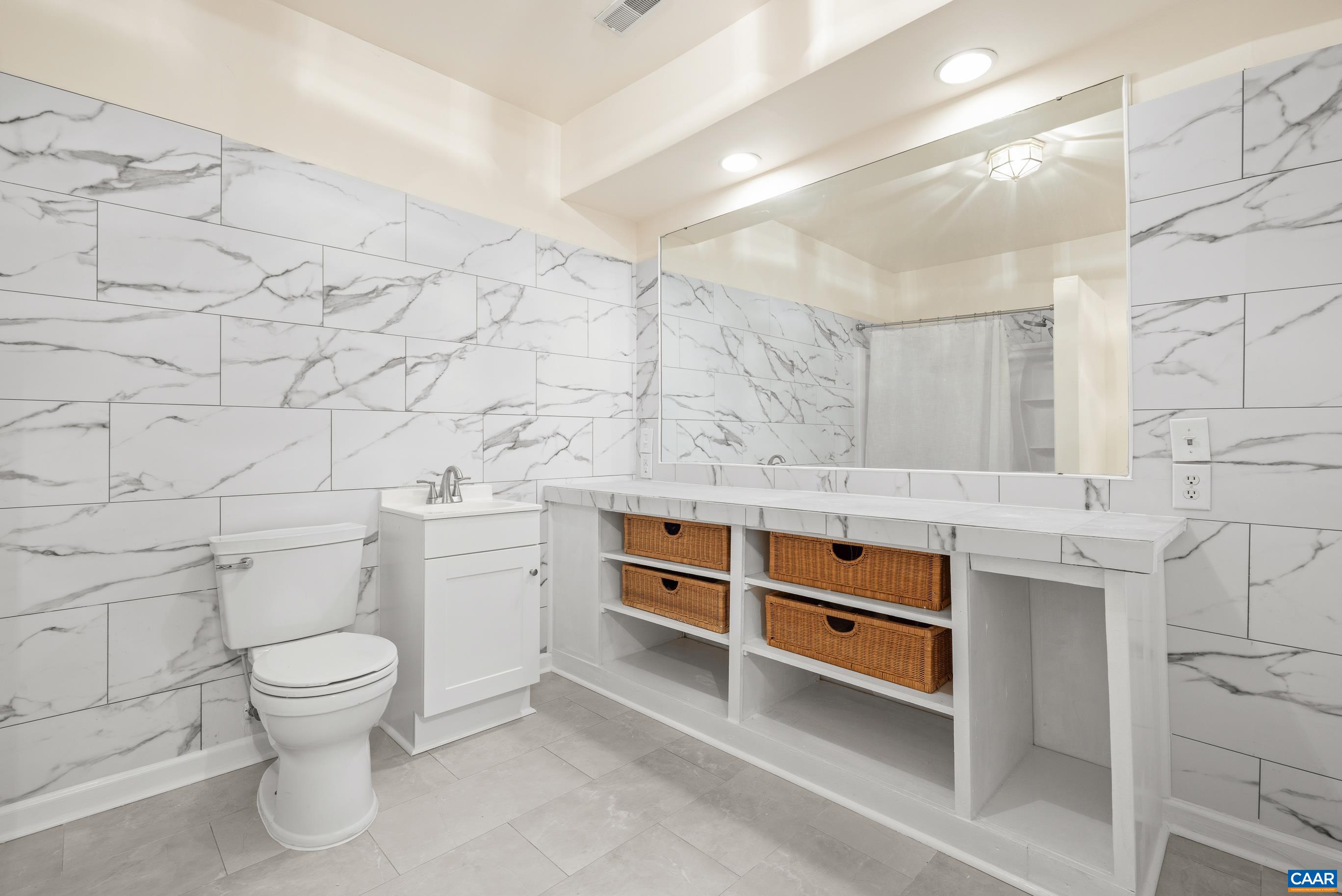 1236 Amber Ridge Road Charlottesville, VA 22901 - Photo 33 of 56 a bathroom with a sink and a toilet
