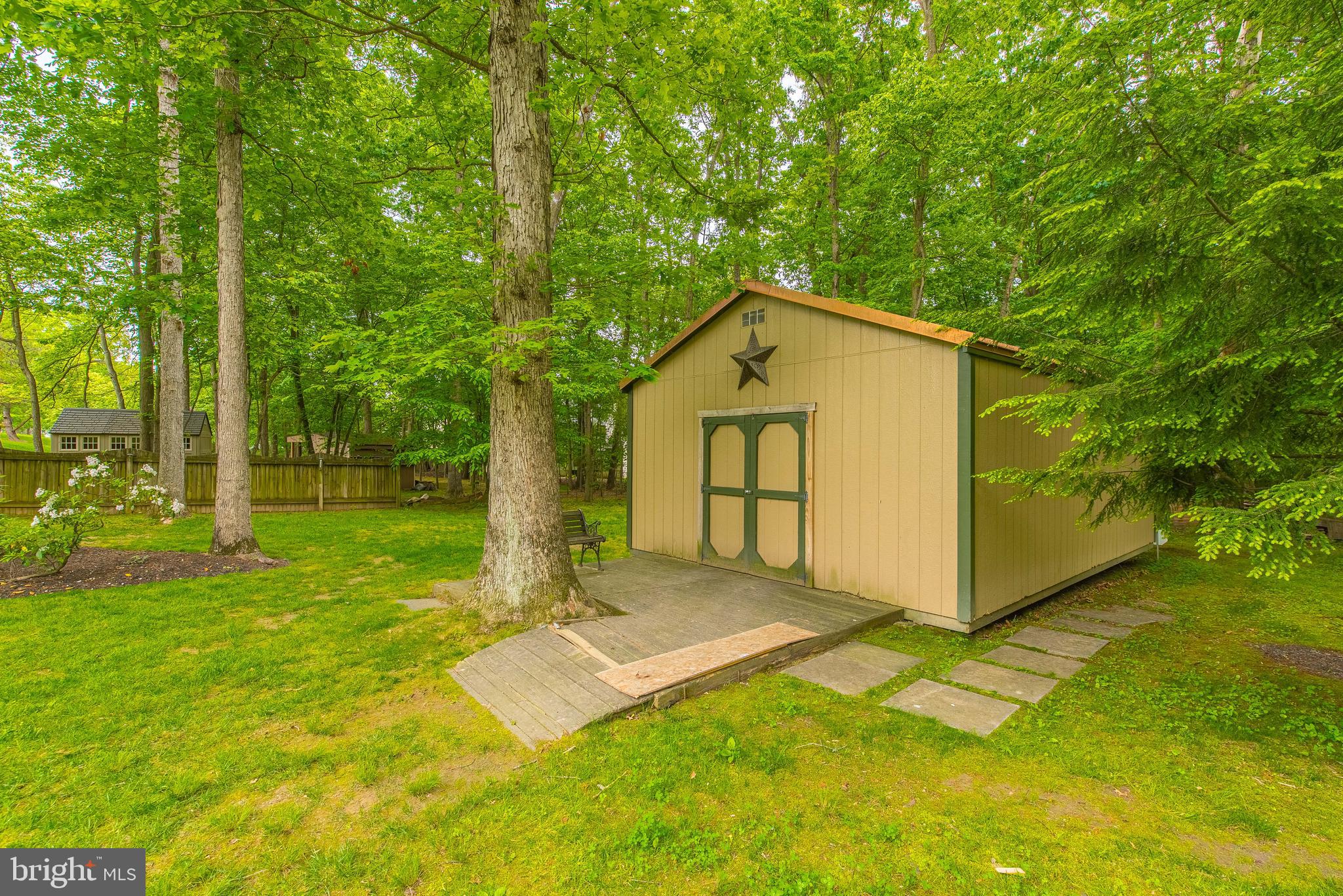 9679 Baltimore Avenue Laurel, MD 20723 - Photo 23 of 56 a front view of a house with garden