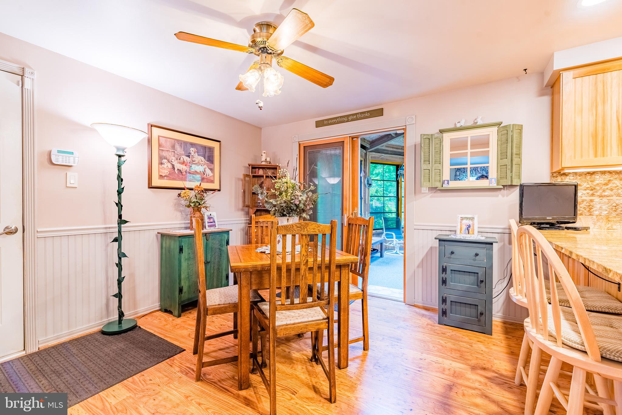 9679 Baltimore Avenue Laurel, MD 20723 - Photo 29 of 56 a view of a livingroom with furniture a ceiling fan and wooden floor