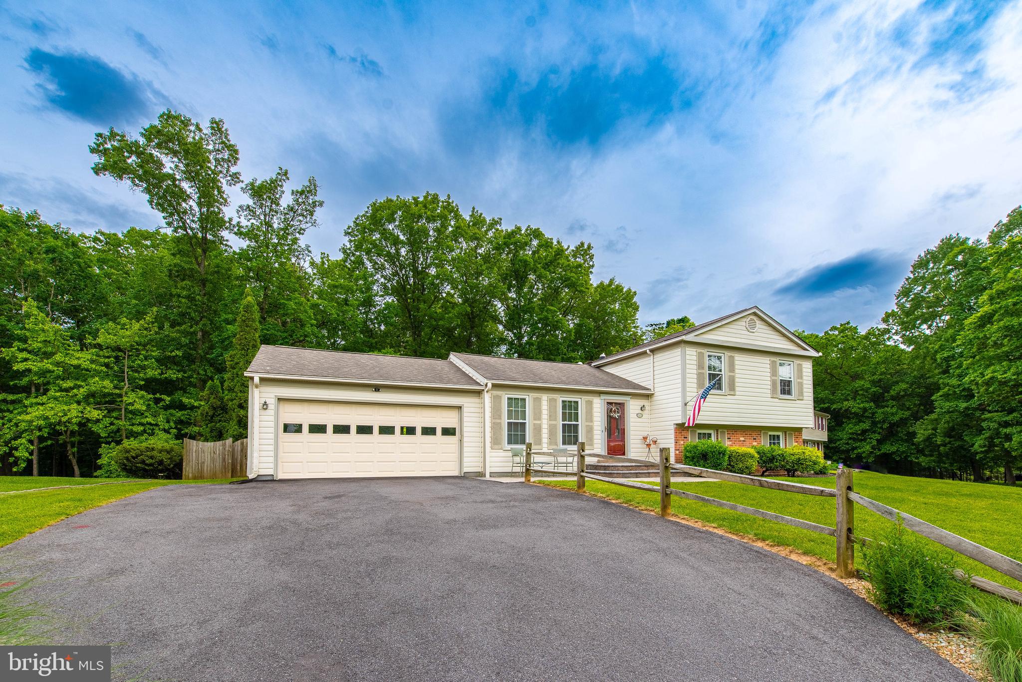 9679 Baltimore Avenue Laurel, MD 20723 - Photo 3 of 56 a view of a house with a yard and a large tree