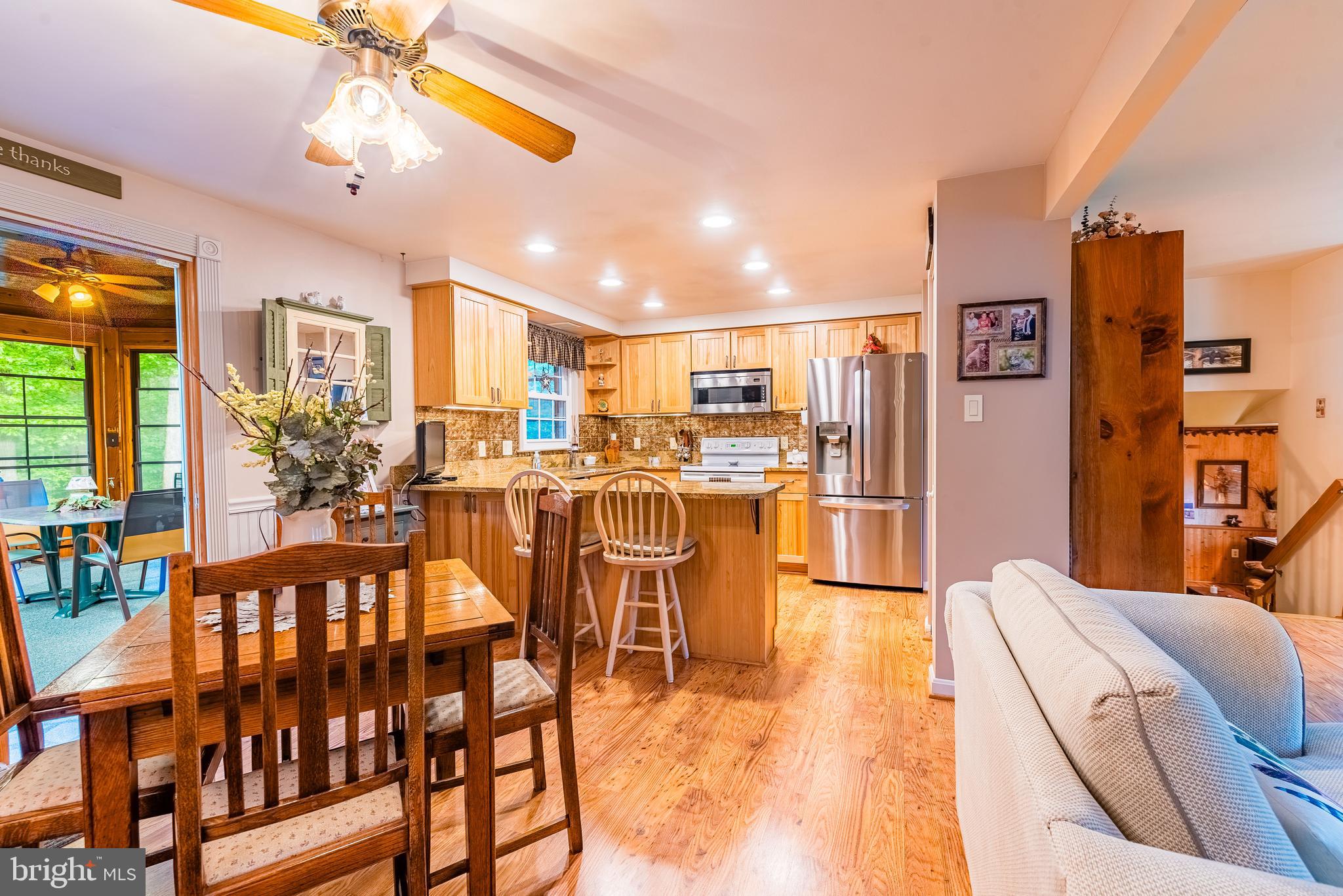 9679 Baltimore Avenue Laurel, MD 20723 - Photo 31 of 56 a living room with stainless steel appliances kitchen island granite countertop furniture and a livingroom