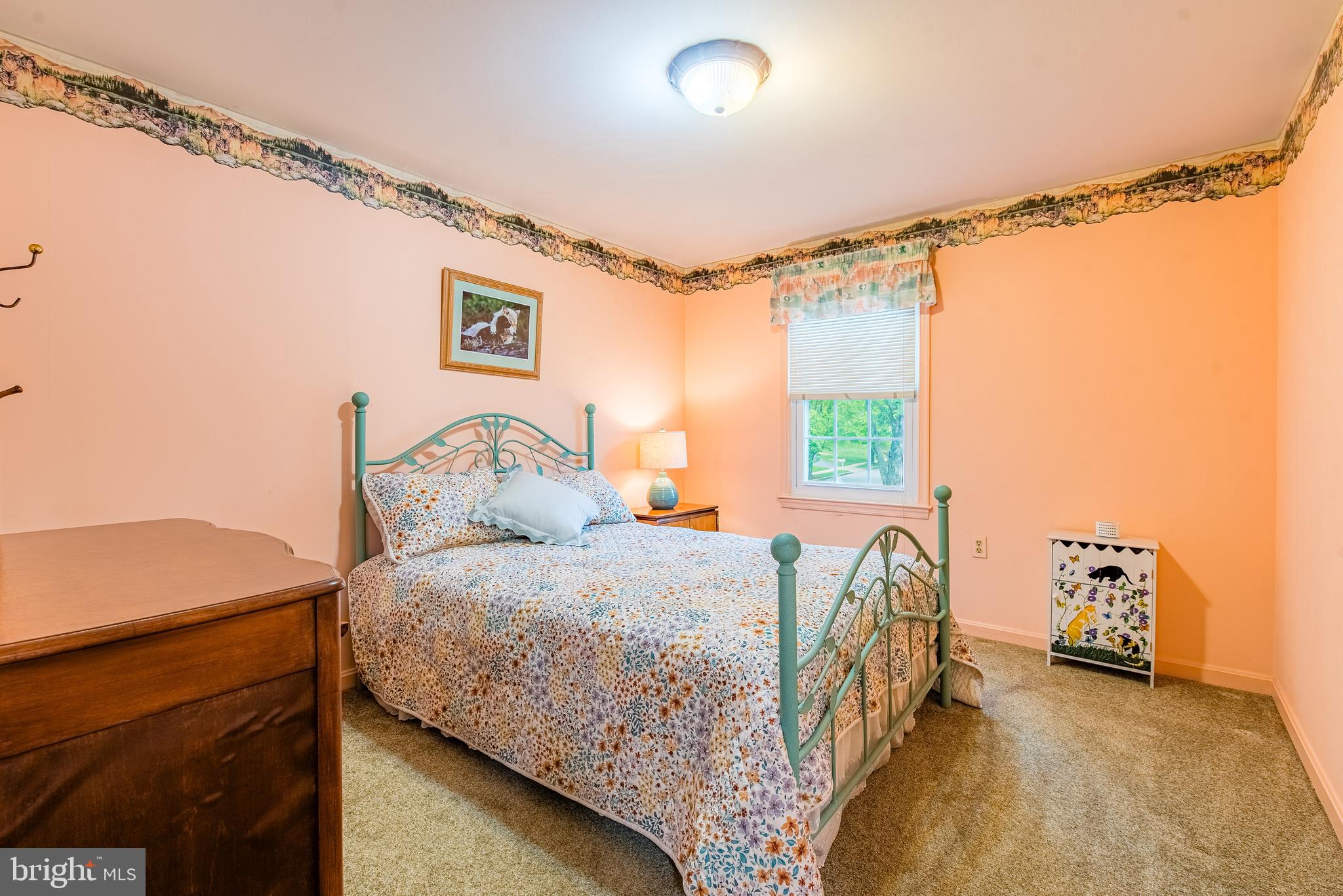 9679 Baltimore Avenue Laurel, MD 20723 - Photo 40 of 56 a bedroom with a bed and a table