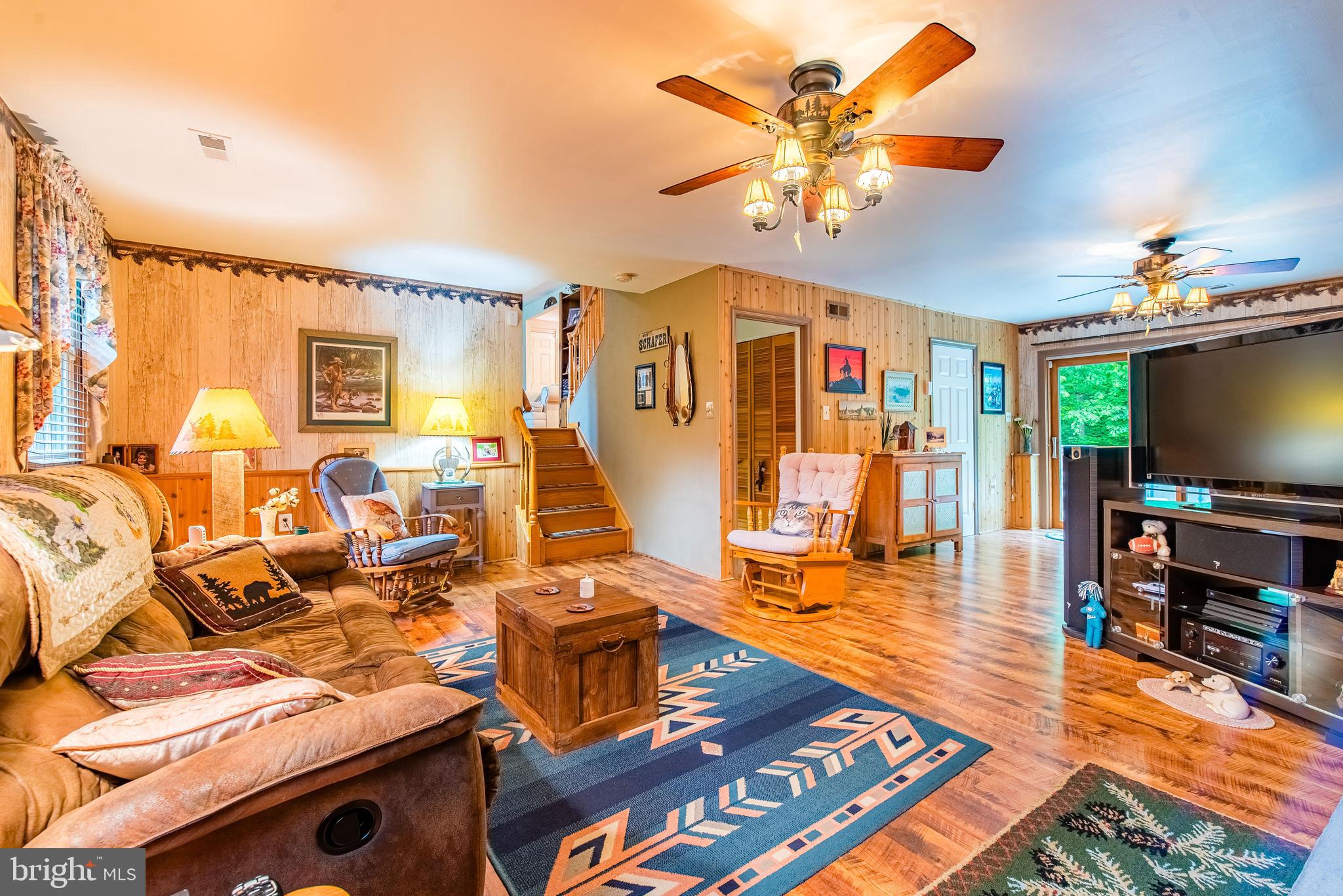 9679 Baltimore Avenue Laurel, MD 20723 - Photo 45 of 56 a living room with lots of furniture and a flat screen tv