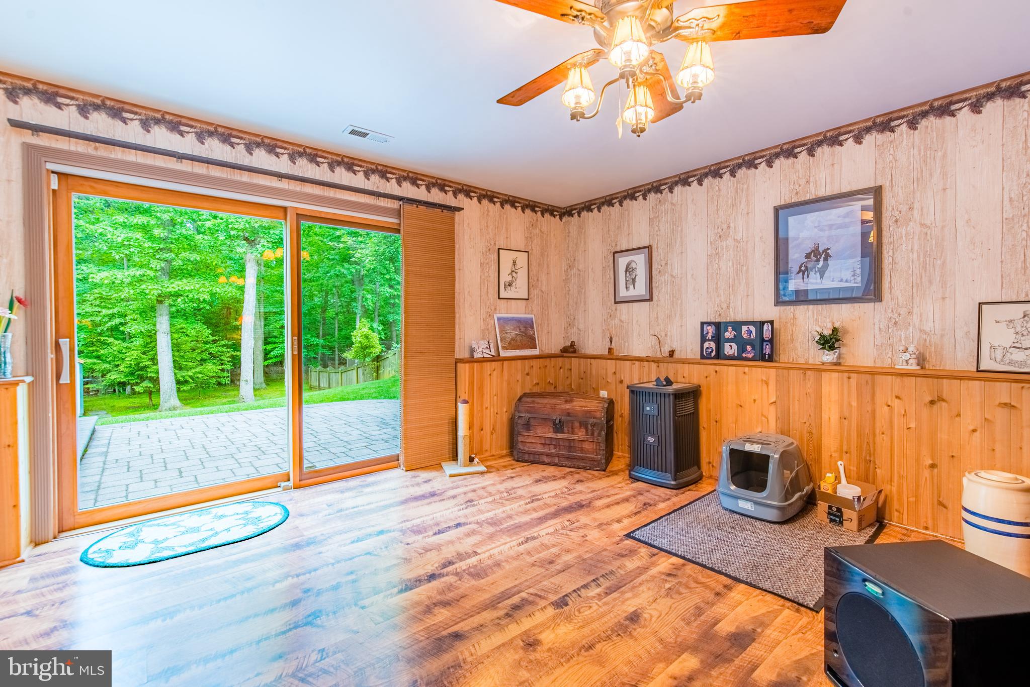 9679 Baltimore Avenue Laurel, MD 20723 - Photo 47 of 56 a bed room with furniture and a wooden floor