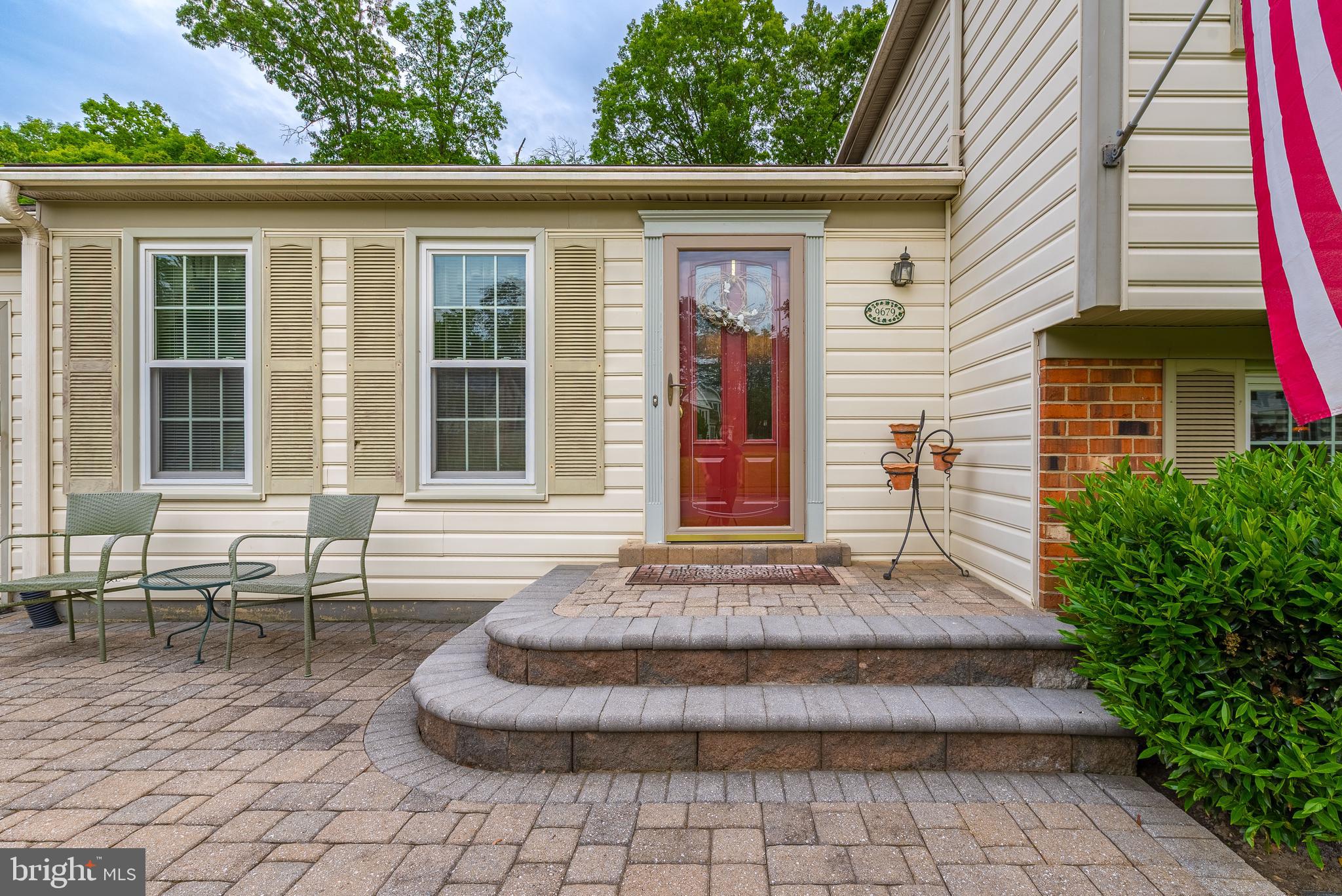9679 Baltimore Avenue Laurel, MD 20723 - Photo 6 of 56 a front view of a house with outdoor seating