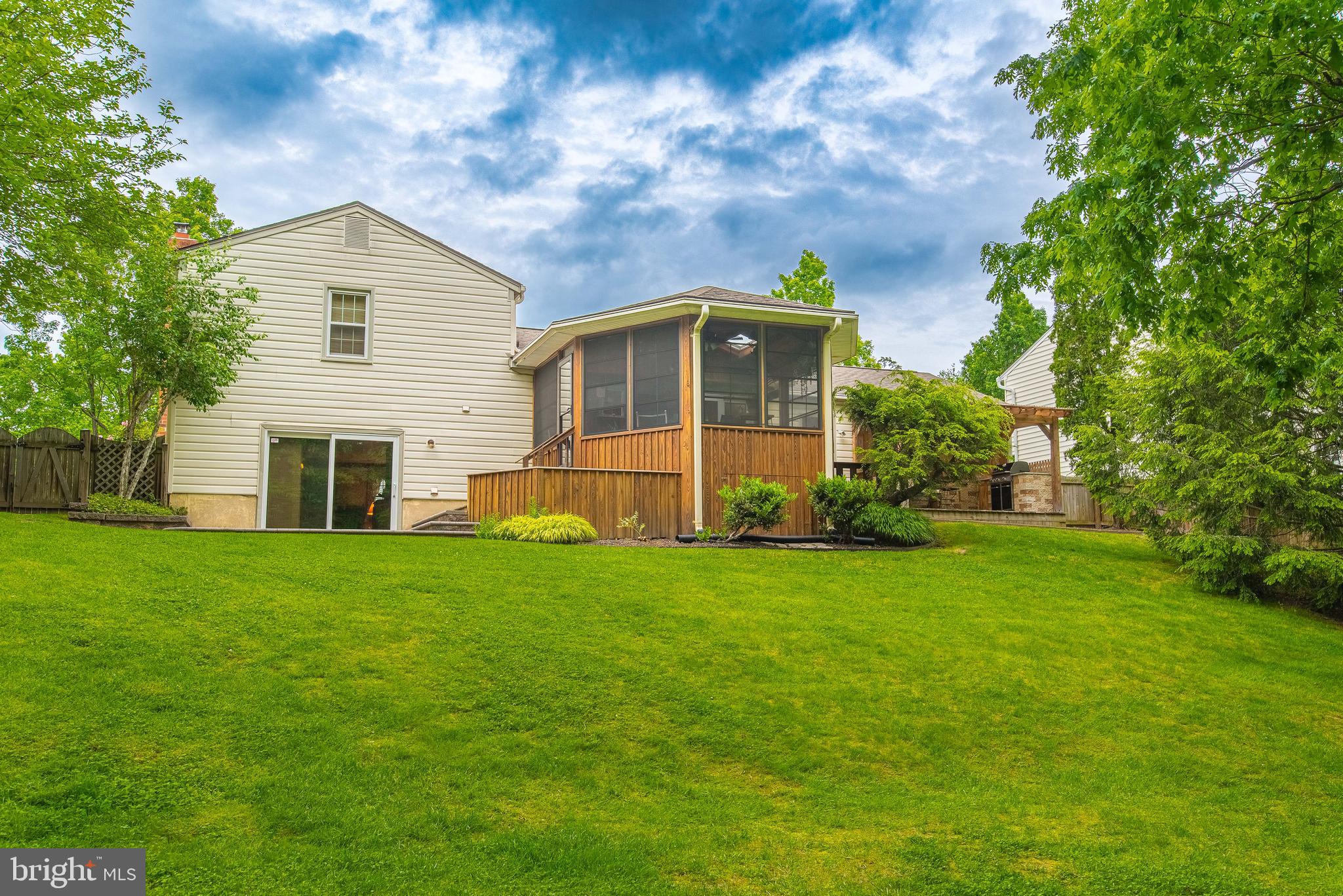 9679 Baltimore Avenue Laurel, MD 20723 - Photo 7 of 56 a front view of a house with a yard
