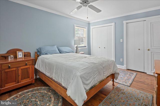 a view of a livingroom with wooden floor and a window