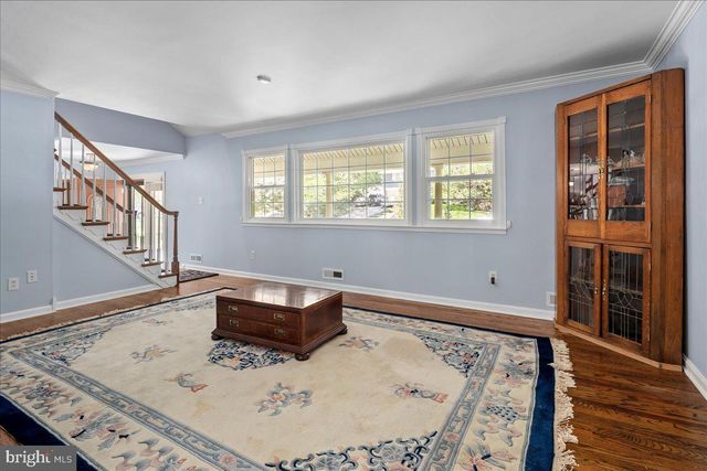 a kitchen with cabinets oven and a dishwasher with wooden floor