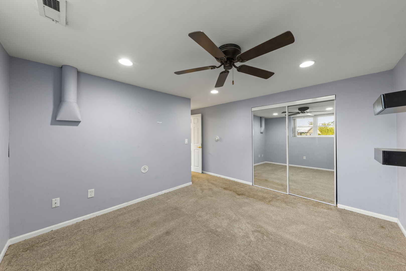 710 Cascade Avenue Romeoville, IL 60446 - Photo 17 of 25 a view of empty room with wooden floor and fan