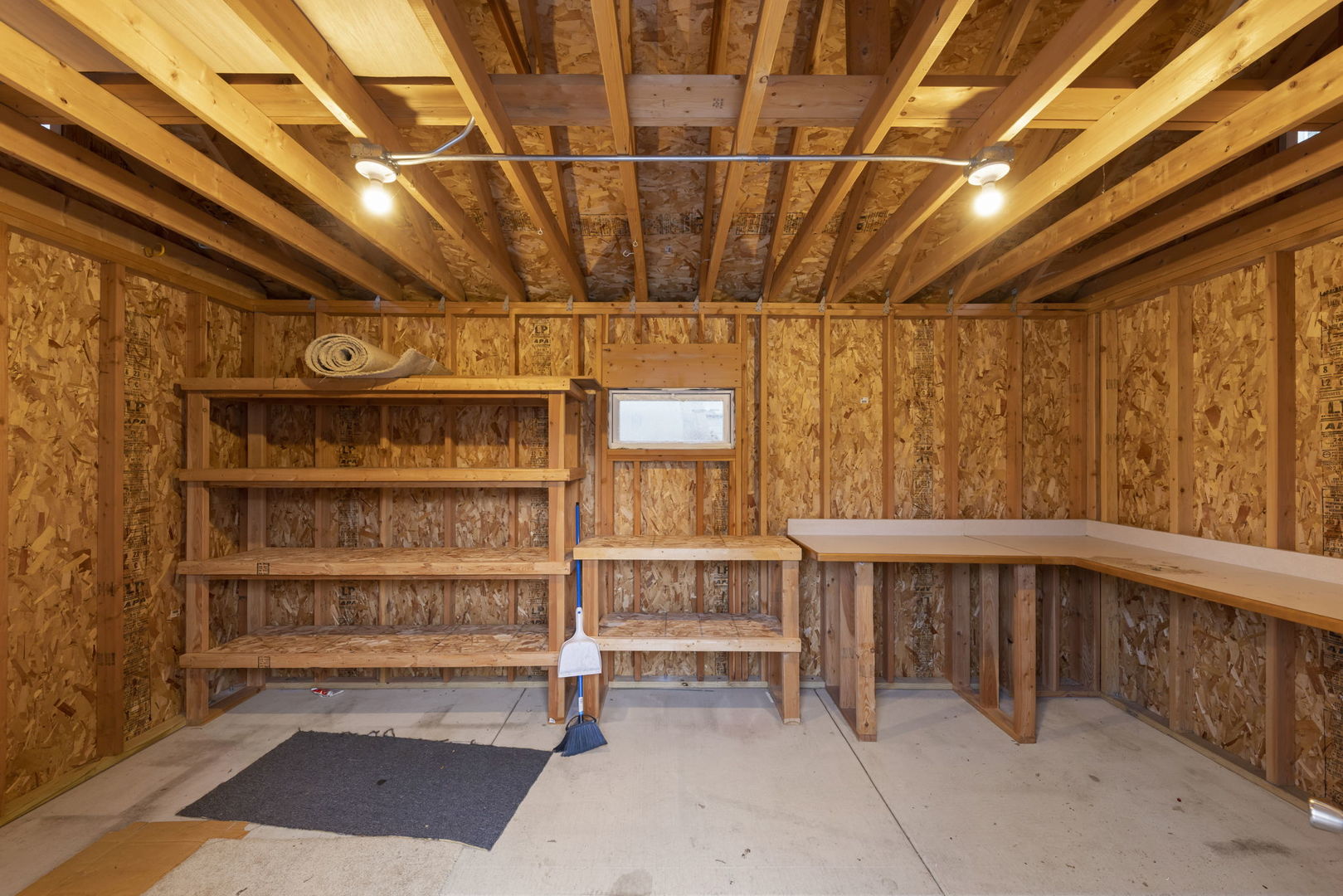 710 Cascade Avenue Romeoville, IL 60446 - Photo 23 of 25 a view of a room with racks on the wall