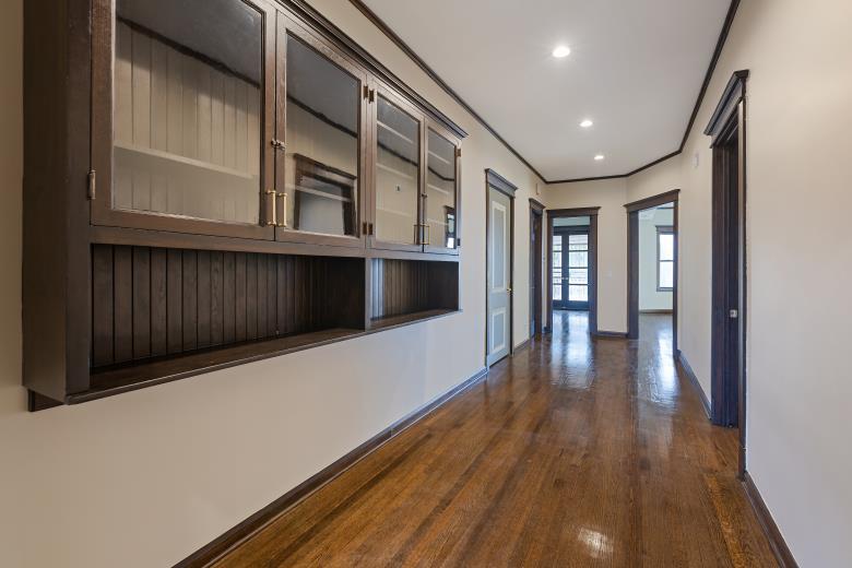 446 East 48th Street, Unit 3E Chicago, IL 60615 - Photo 12 of 33 wooden floor in an empty room with a window
