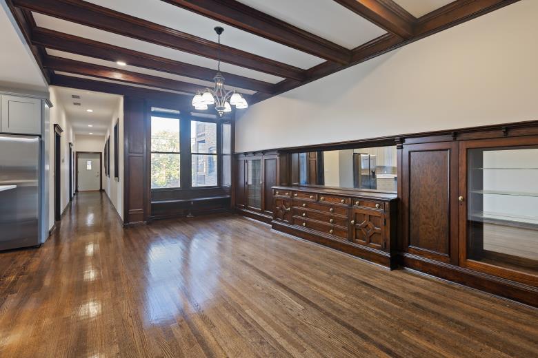 446 East 48th Street, Unit 3E Chicago, IL 60615 - Photo 18 of 33 a view of a room with wooden floor and stairs